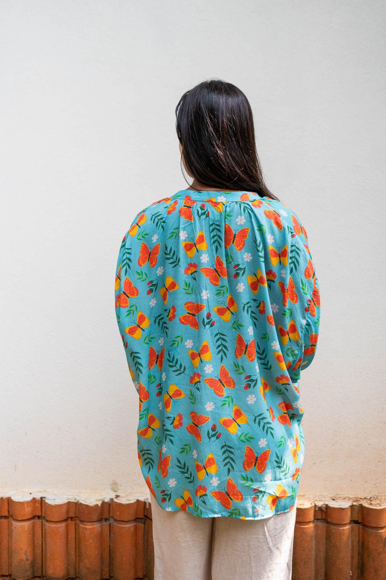 Blue free-size shirt with a cute butterfly print