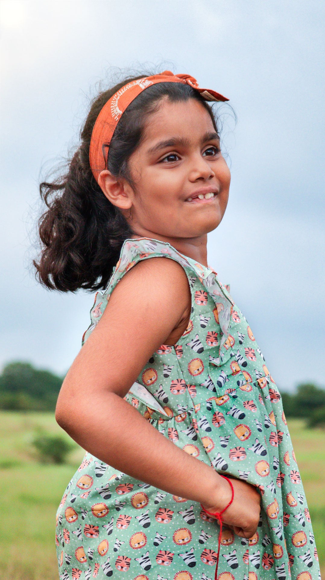 Girls' green cotton frock with nursery animals print