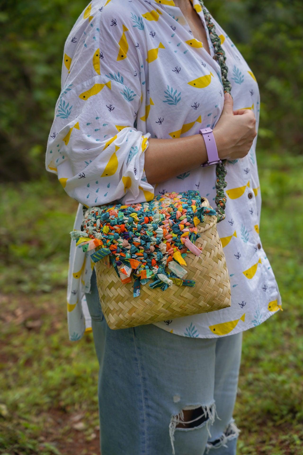 Handwoven traditional style woven bamboo bag from Goa with fabric detailing